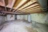 Unfinished basement with water heater