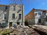 Back of property featuring stucco siding, fence, and cooling unit