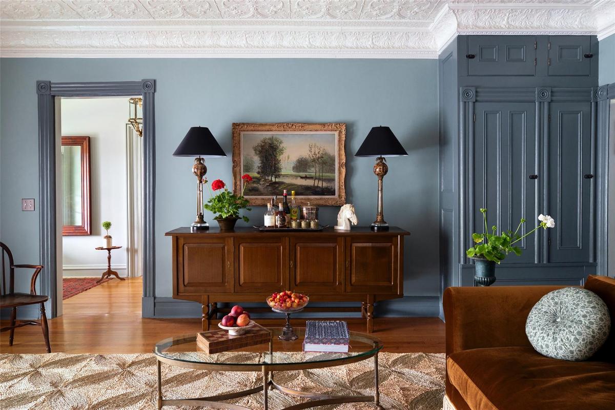 Living area featuring wood finished floors and ornamental molding