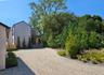 View of yard featuring gravel driveway