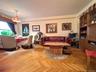 Elegant herringbone hardwood floors, open to the dining area that has a double panel window