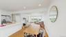Dining area with crown molding, baseboards, recessed lighting, and light wood-style floors