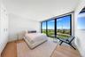 Bedroom featuring floor to ceiling windows, light wood-style flooring, recessed lighting, and a closet