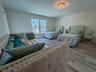 Guest bedroom with flexible layout and natural light.