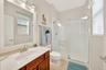 2nd_bedroom_en-suite_bathroom_pic_#2_showing_shower_with_updated_glass_enclosure