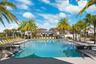 Resort style community clubhouse with a community pool, fitness center and lake front pool.