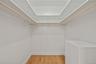 Spacious closet featuring light wood-style floors
