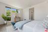 Bedroom featuring wood-style f