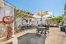 View of patio with a pergola and outdoor dining area
