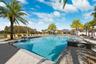 Resort style community clubhouse with a community pool, fitness center and lake front pool.
