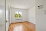 Spare room with light wood-style flooring and radiator