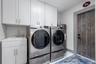 Laundry Room. Sink, Overhead Cabinets, Access to side yard with artificial turf.