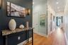 Corridor featuring crown molding, light wood finished floors, and recessed lighting