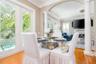 Breakfast area showing access to Living room French doors leading to pool