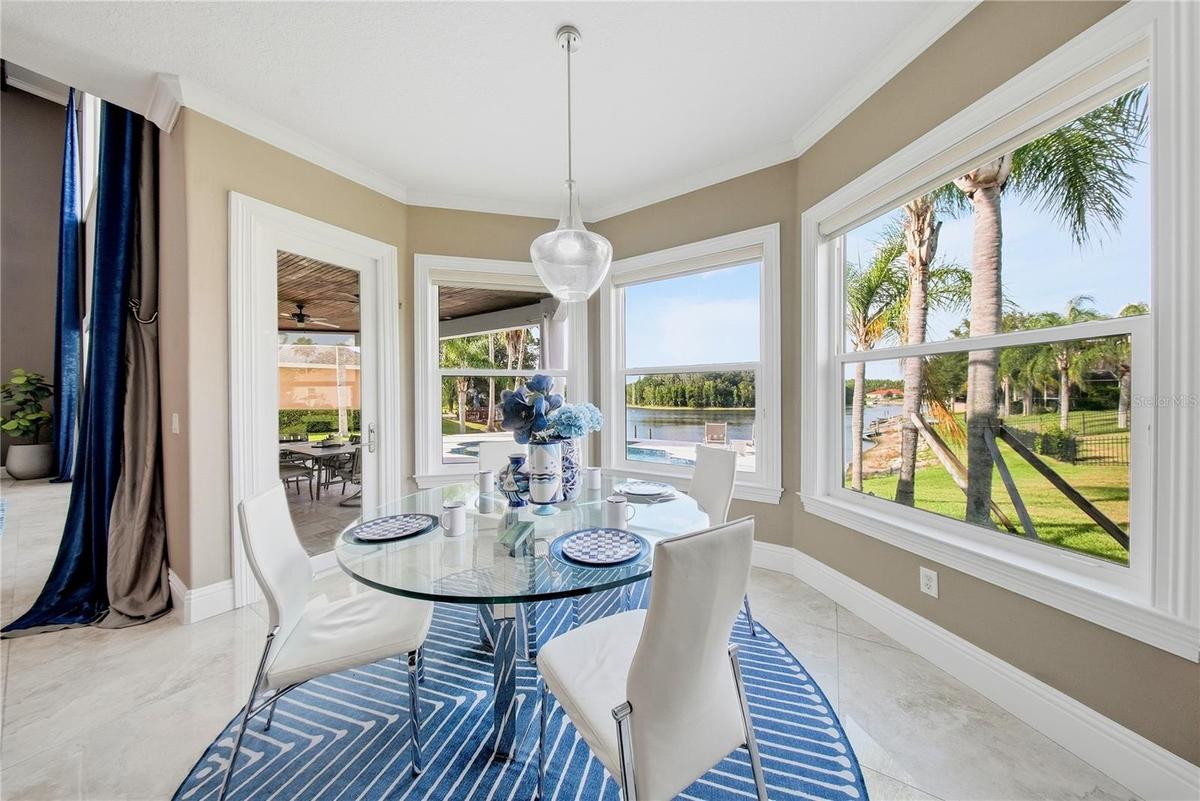 Breakfast nook with panoramic windows facing the lake