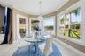 Breakfast nook with panoramic windows facing the lake