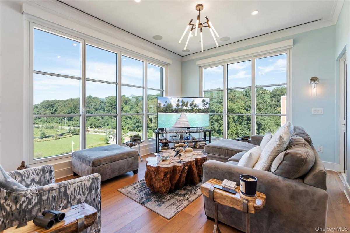 Living area with view of harbor, crown molding