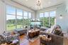 Living area with view of harbor, crown molding