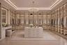 Custom-designed walk-in closet featuring boutique-style illuminated cabinetry, glass-front storage, a center island, and a dedicated vanity for a refi