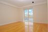 Spare room with light wood finished floors and baseboards