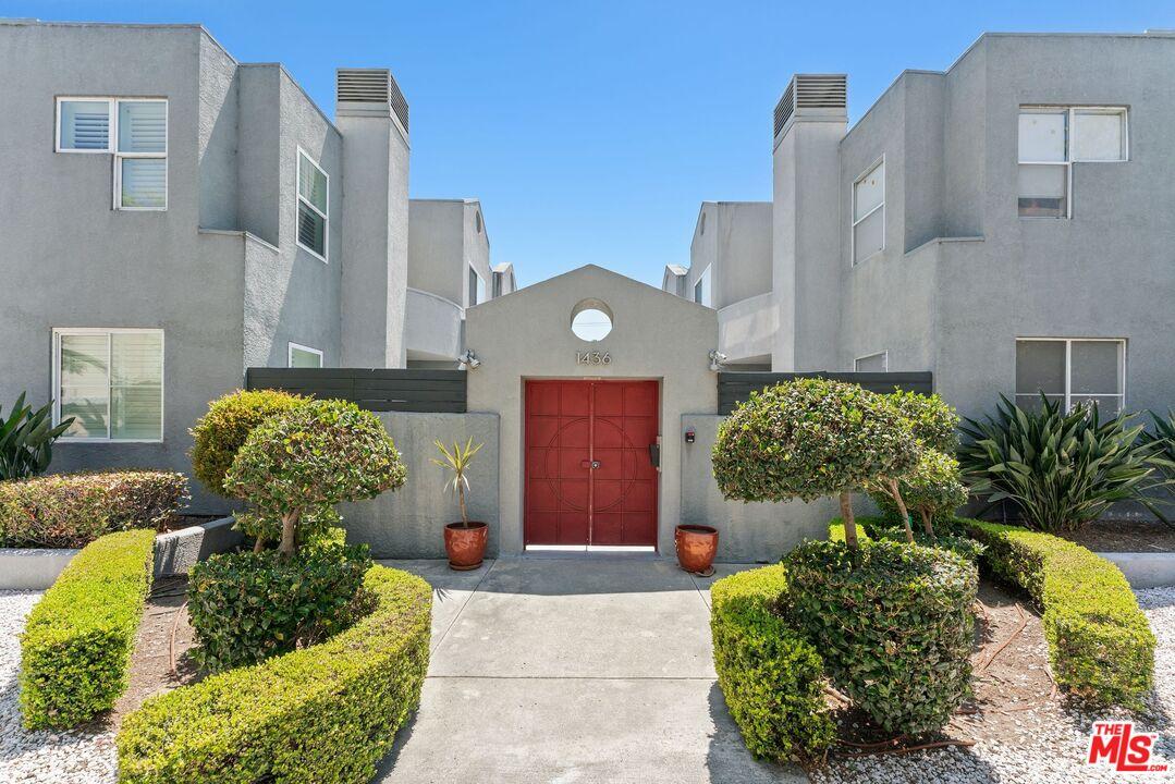 Grey stucco multi-unit buildin