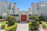 Grey stucco multi-unit buildin