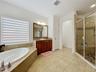 Dual vanities , step in show, soaking tub and separate water closet