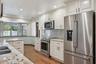 Remodeled Kitchen with Granite Countertops and Stainless Steel Appliances