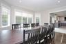 Dining area with light wood-type flooring and recessed lighting