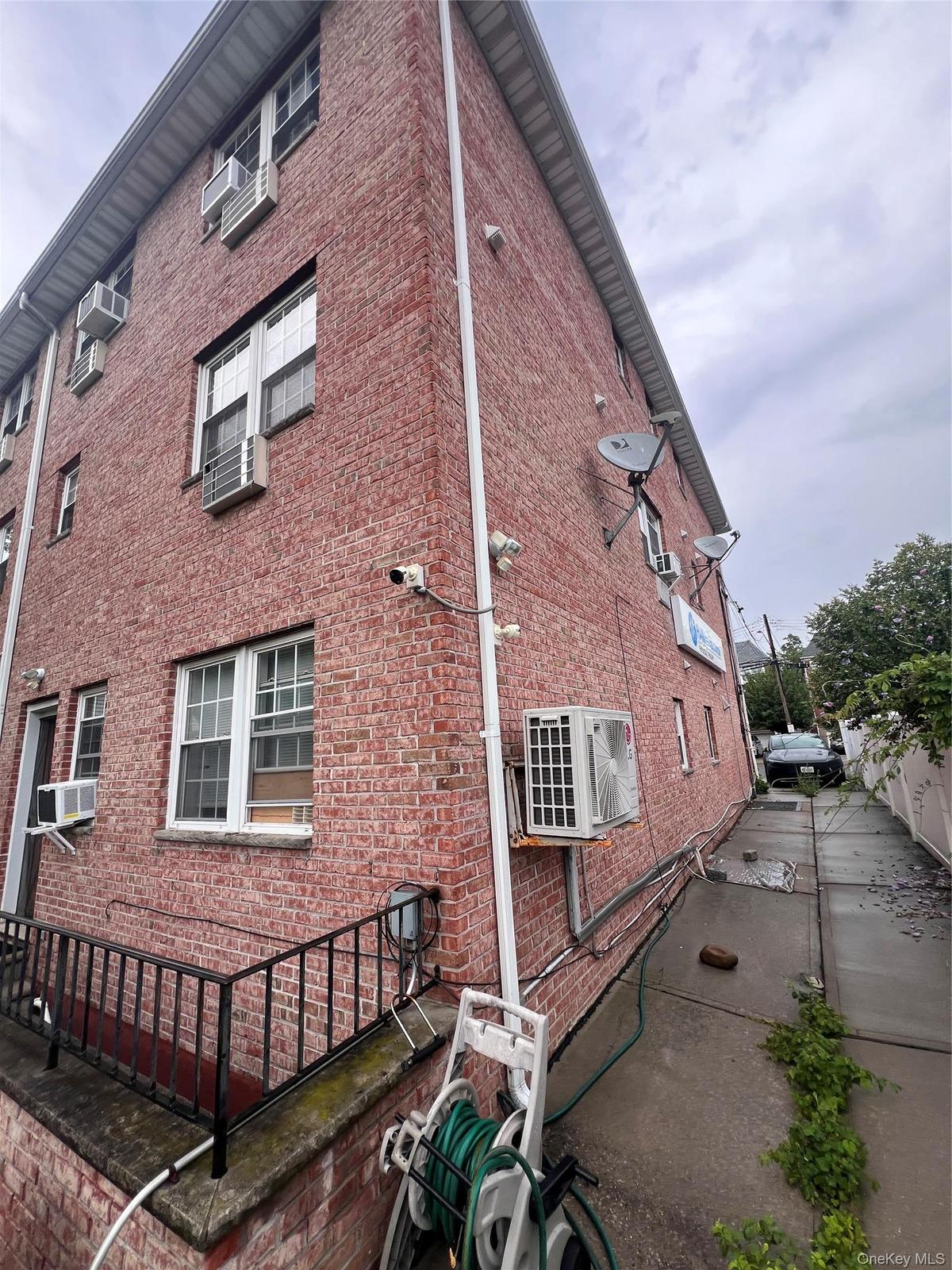All Brick Corner lot Newer Building with full finished basement with outside entrance.  Total 4 family  apartment. mixed use building
