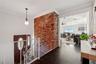 Entryway with ornamental molding, dark hardwood / wood-style floors, and ceiling fan