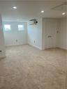 Walk up to the 4th Floor with heat and air conditioning! Huge finished 4th floor, featuring wall to wall carpeting, closets, pull down stairs above w/