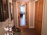 A discreet pocket door with a privacy shade separates the guest wing, creating a private retreat for the 2 guest bedrooms and bath.
