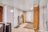 Room featuring light-colored wood-finish flooring, light gray walls, and white ceiling