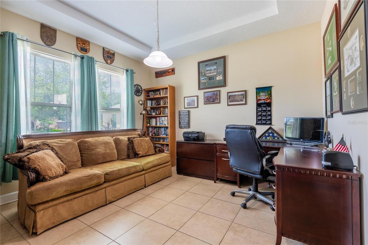 The family room off of the foyer is currently being used as an office.