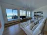 Living room with wood finished floors and visible vents