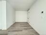 Unfurnished room with light wood-style flooring and baseboards