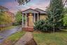Brick exterior with a covered porch
