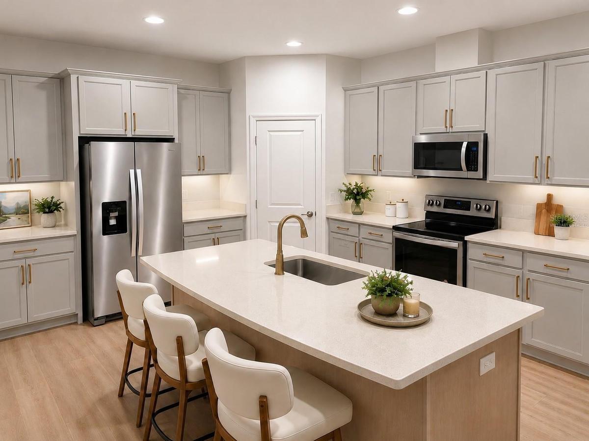 14048 Larkspur Lake Dr - Beautifully updated kitchen with quartz countertops, expansive island, and stainless steel appliances. Virtually staged.