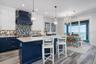 Kitchen and dining with expansive views of Tampa Bay and Skyway Bridge