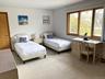 Bedroom with light colored carpet