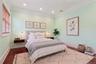 Hardwood flooring with a high-gloss finish, recessed lighting, crown molding, and a window with wood blinds