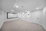 Cinema featuring light carpet and recessed lighting