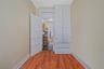 Unfurnished room featuring hardwood / wood-style flooring and baseboards