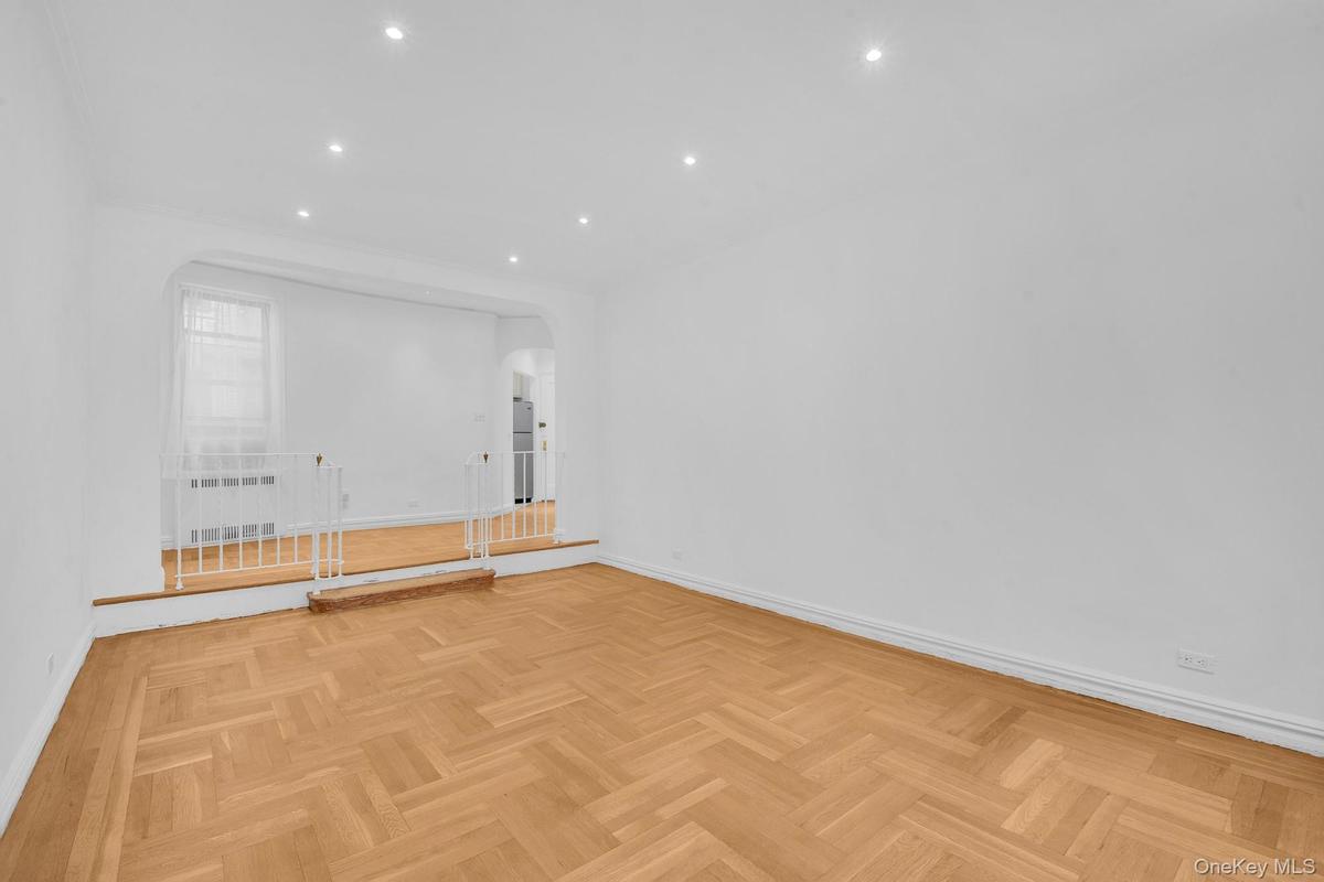 Sunken living room with hardwood floors.