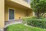 This door leads to the garage and there is a nice patio that can be used for added outdoor space