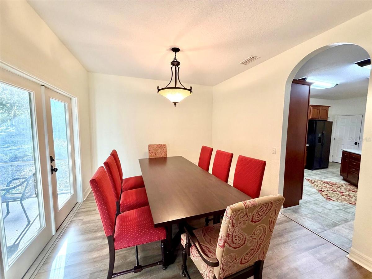Dining Room with french doors to a side screened porch