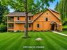Board and Batten wood home with two side porches