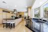Kitchen features a gas range/hood, Subzero refrigerator & double convection ovens