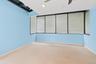 Carpeted spare room with baseboards and ceiling fan